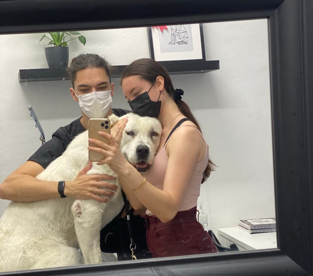 Timea and Kristian with a dog in our salon